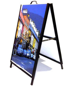 A frame sign with an image of a street scene.