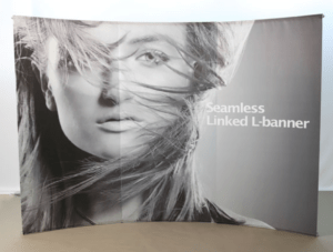 A curved display with a woman 's face on it.