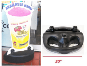 A large cup holder and a black plastic face mask.