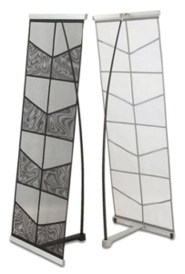 A pair of tall glass sculptures with black and white designs.