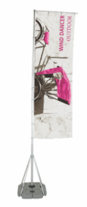 A pink flag hanging from the side of a pole.